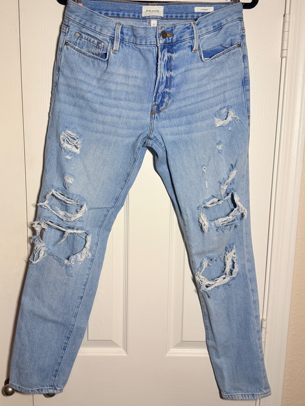 FRAME "Le Garcon" mid-rise boyfriend jeans in a light blue distressed wash